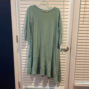 LOGO maxi dress with a slight angled him. Great detail at the bottom.